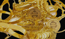 collection of gold jewellery in a pile