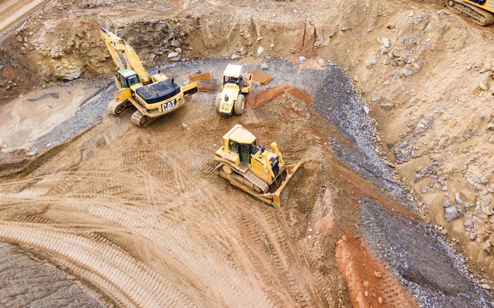 Diggers and construction equipment at a mine quarry