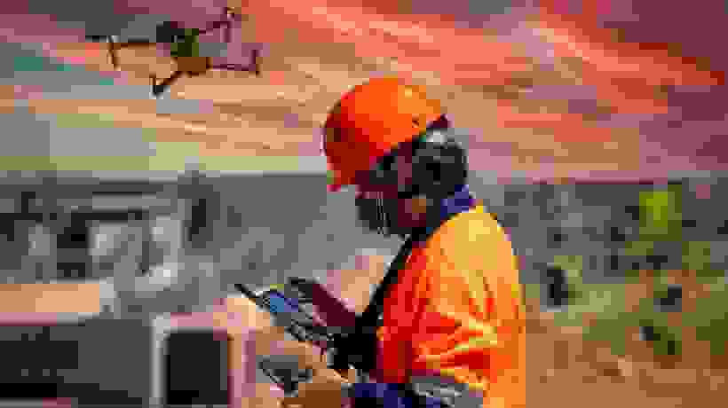 A man in a hard hat at a mine