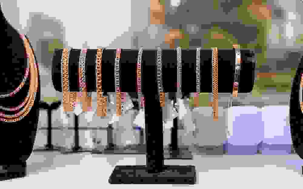 Gold bracelets on a stand